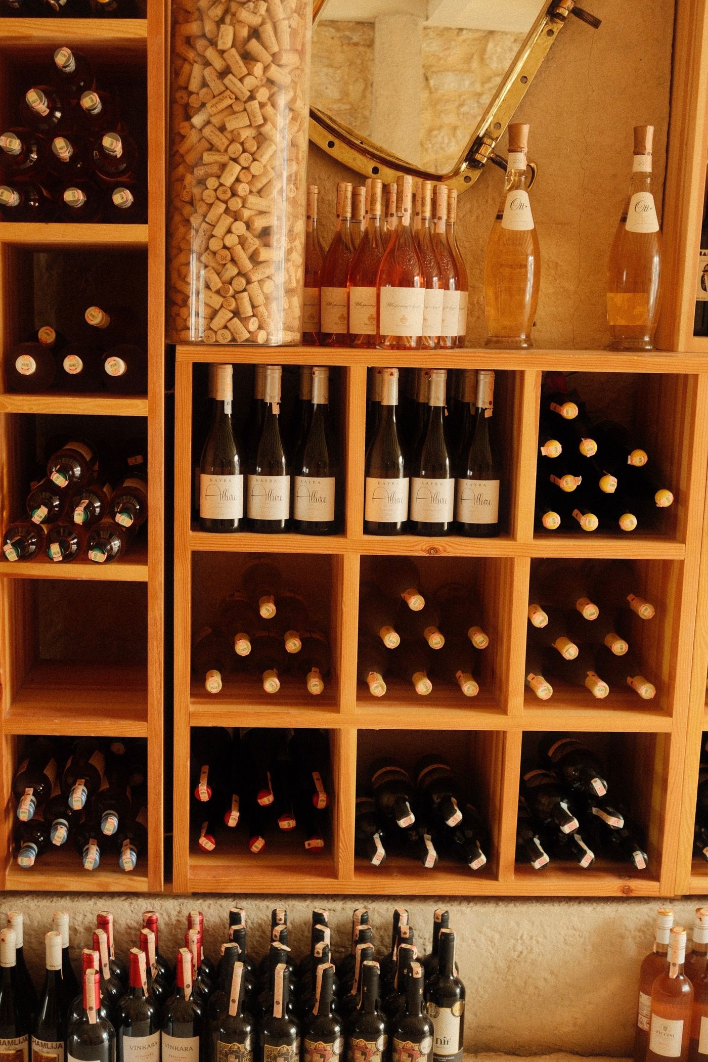 Wooden racks of wine bottles in the shop