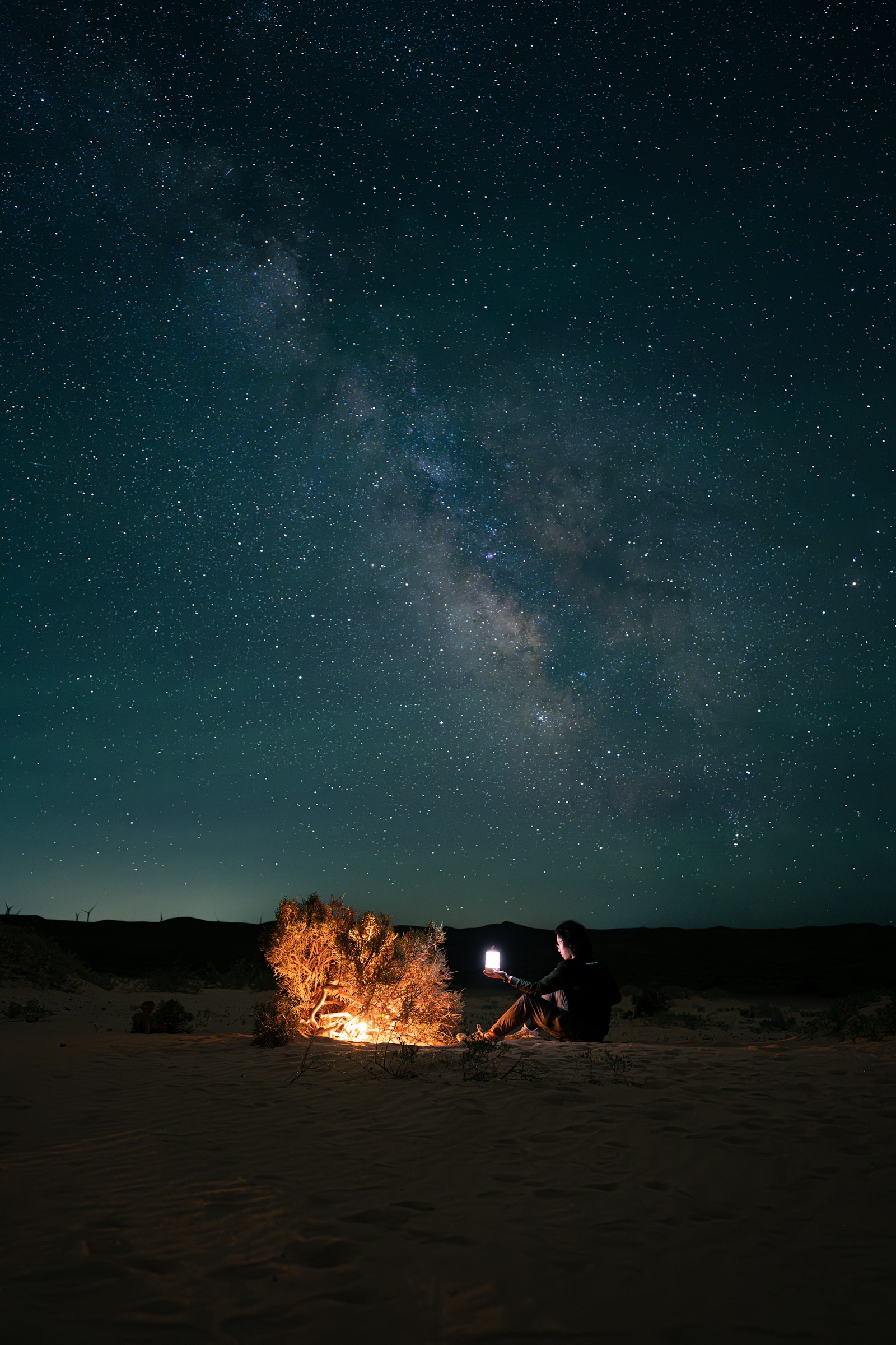 A campfire burning at a pitch after dark